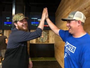 Axe throwing bar featuring projected targets and games where friends meet for a great time in Port Orchard, WA